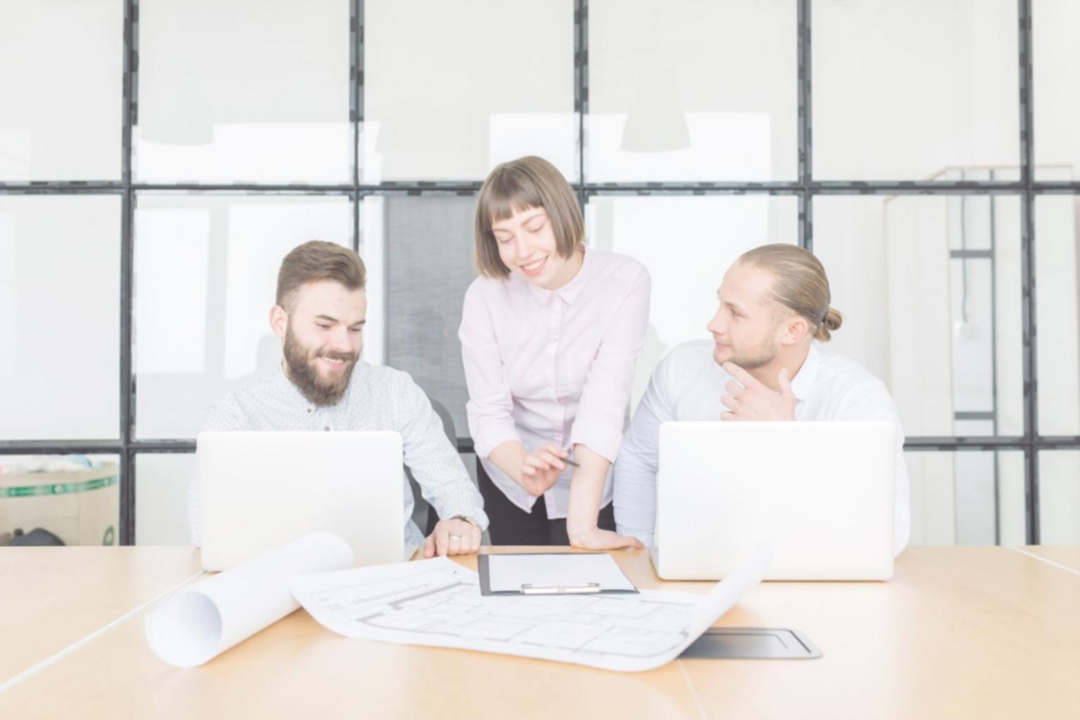 Professional financial planning session with documents and charts